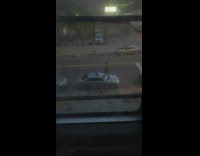 Shirtless man kicks car window while yelling at lady 