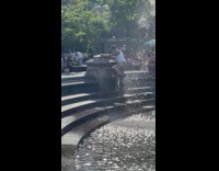 Guy massages body with water fountain 