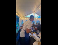 Father catches thrown egg with his mouth