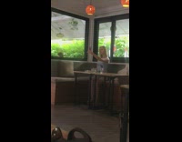 Blue shirt girl restaurant table selfie mug