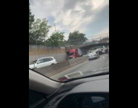 Truck stuck underneath the bridge 