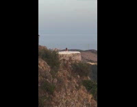 White dress girl brown mountain viewpoint lamppost  