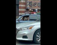 Man shows foot twiddling out car window