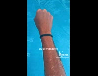 Collab ClipsIG - Woman shows arm color after swimming 