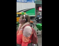 Man wear green all over his body ride on bike at NY 