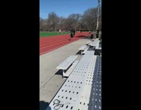 Neon black shirt girl runs track soccer