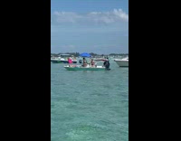 two girls one man on small boat pics