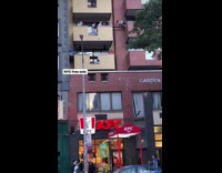 Little girl crawling across two high rise porches on a wooden plank