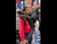 Guy walks around snake wrap around body