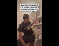 Guy on toilet pretends to throw poop and toilet paper 