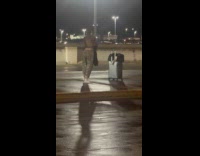 Woman dance video middle of the street