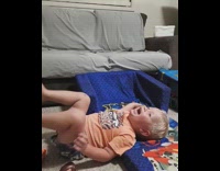 Toddler boy jumps off couch onto chair and faceplants 