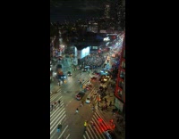 Large crowd parties to bad bunny music in street