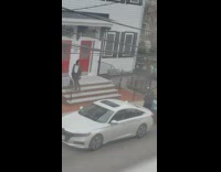 White shirt lady red door step 