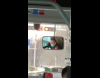 Bus driver do warm up stoplight mirror