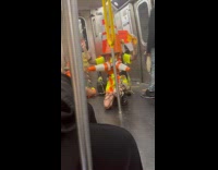 Group wear traffic cone do random things subway