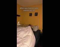 Guy rolling around and jumping in bed blue sheets 