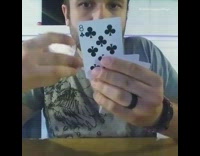 Guy magic trick playing card in mouth