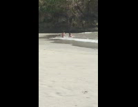 Girl white swimsuit turn over lay beach