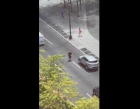 Guy exercises in middle of street 