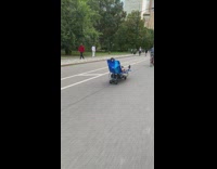 Guy rides lawn chair go kart past NYPD 