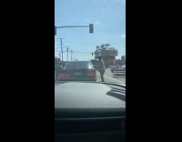 Lady gets out car to spray lysol 