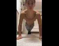 Guy with chest tattoo does claps between push ups then hits chin on ground