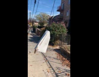 Pizza box hanging on street electrical wire