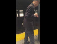 Man brown hat punches metal pillar in subway station 110 street