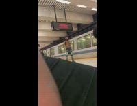 Shirtless guy on phone almost gets hit by moving train