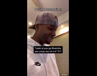 man makes friends with roomba in quarantine