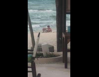 Shirtless muscled man kneel pose beach shore Part 2