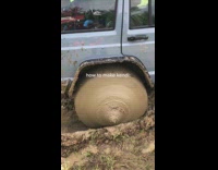 Off road car with mud collecting at rear wheels 