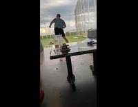 Blue shirt guy lets go golf club 