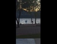 Guy dance video lakeside silhouette sunset mountain