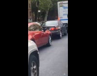 Man ride bike tire on head street