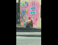 Yellow shirt girl pink wall mural alley 
