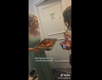 Girl offers her friend leftover chicken
