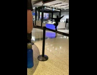 Woman in black outfit tiktok dance in front of currency exchange