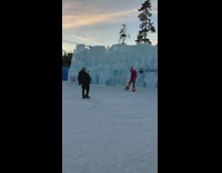 Woman red jacket hula-hoops performance ice castles