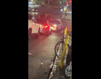 NYPD arguing with man through car megaphone