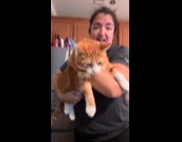 Woman holding cat squeak