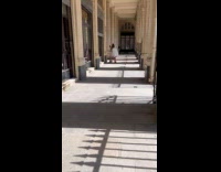 Woman white outfit with bag at hallway