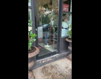 Man and woman photo shoot coffee shop entrance