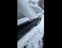 Filmer cracks the ice formed outside car
