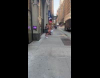 Person wears inflatable costume walk on street