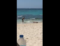 Girl lays on back in water