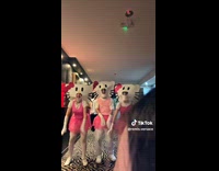 Trio dancing while wearing hello kitty costume