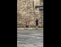 Black bralette girl leans back legs spread 