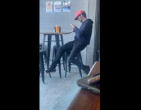 Collab IITW - Man in jacket hoodie takes picture of his beer on the table